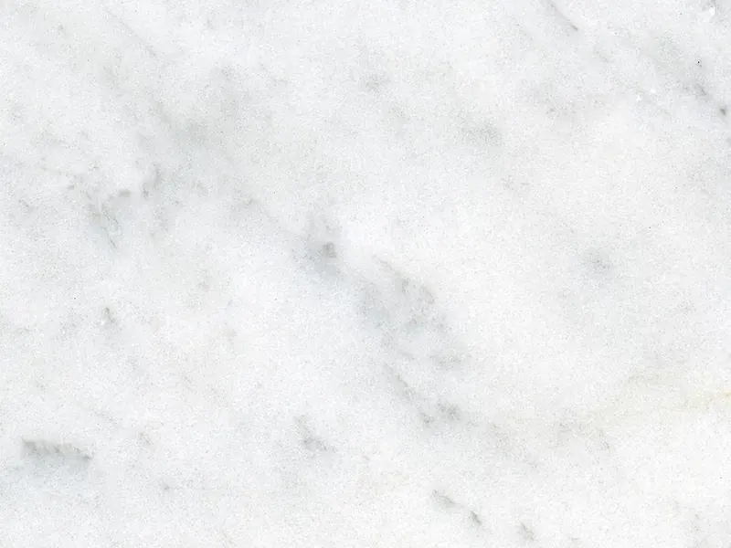Mármore Carrara polido, fundo branco acinzentado com veios cinza